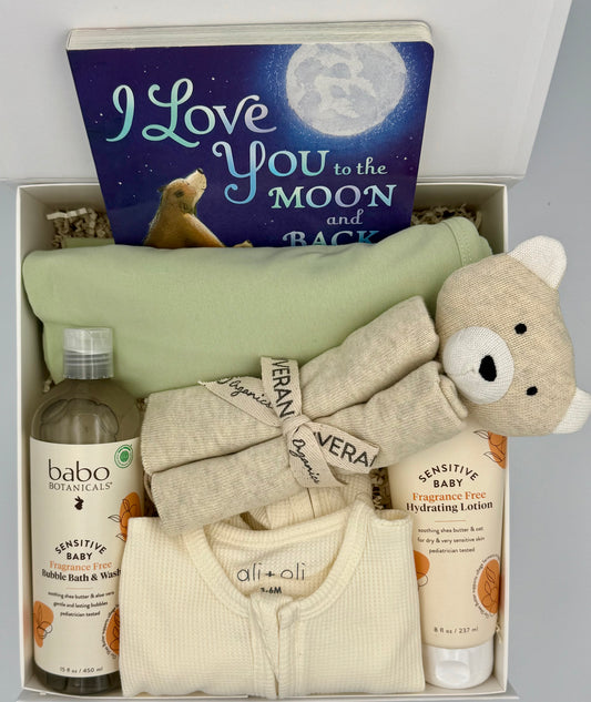 Baby gift set with books, bottles, and toys in a box