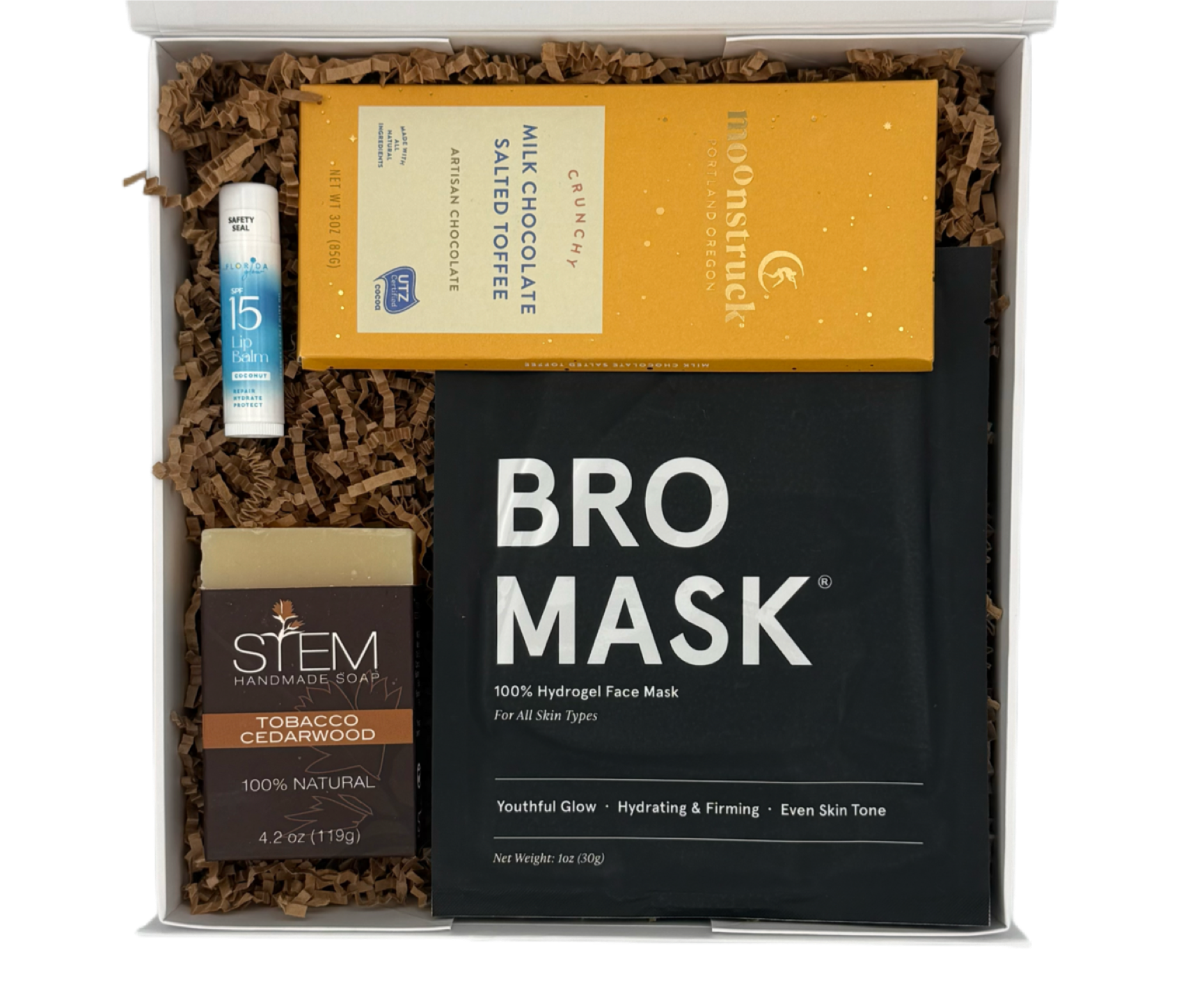 Gift box with 'BRO MASK' and other items on a white background