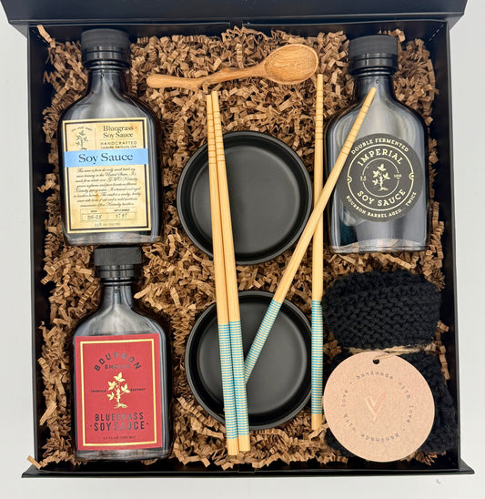 Gift set with soy sauce bottles, chopsticks, and other items in a box