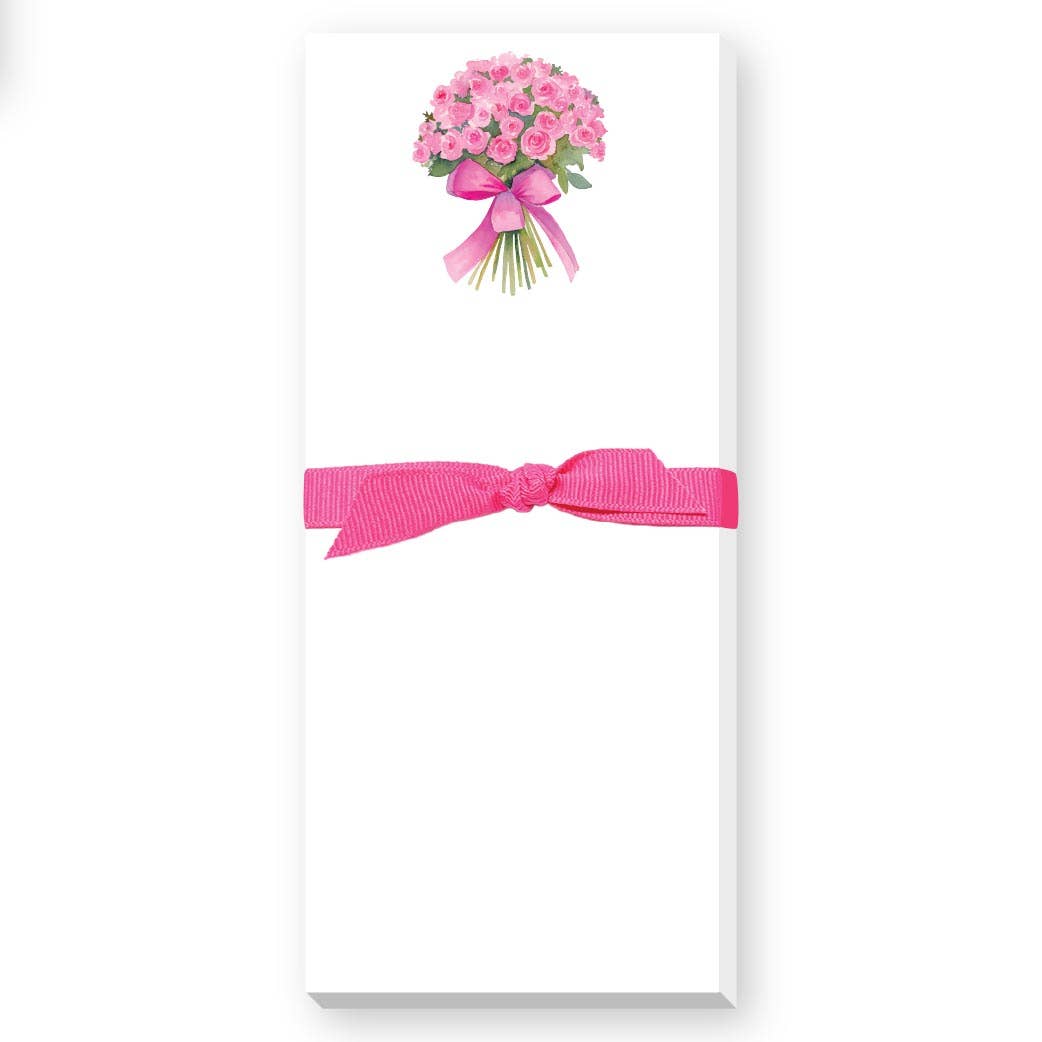Notepad with pink flowers and bow on a white background