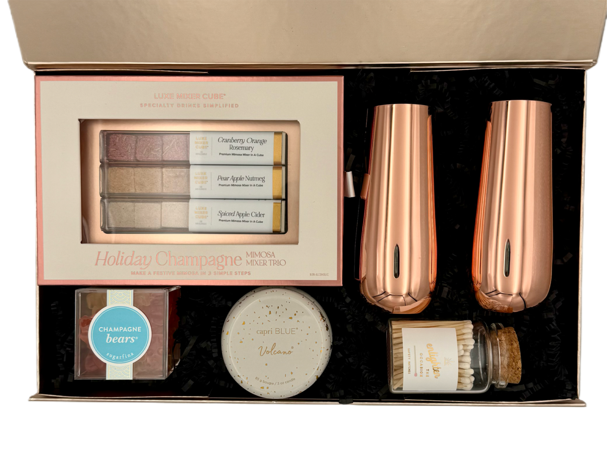 Rose gold holiday gift set with decorative items in a box