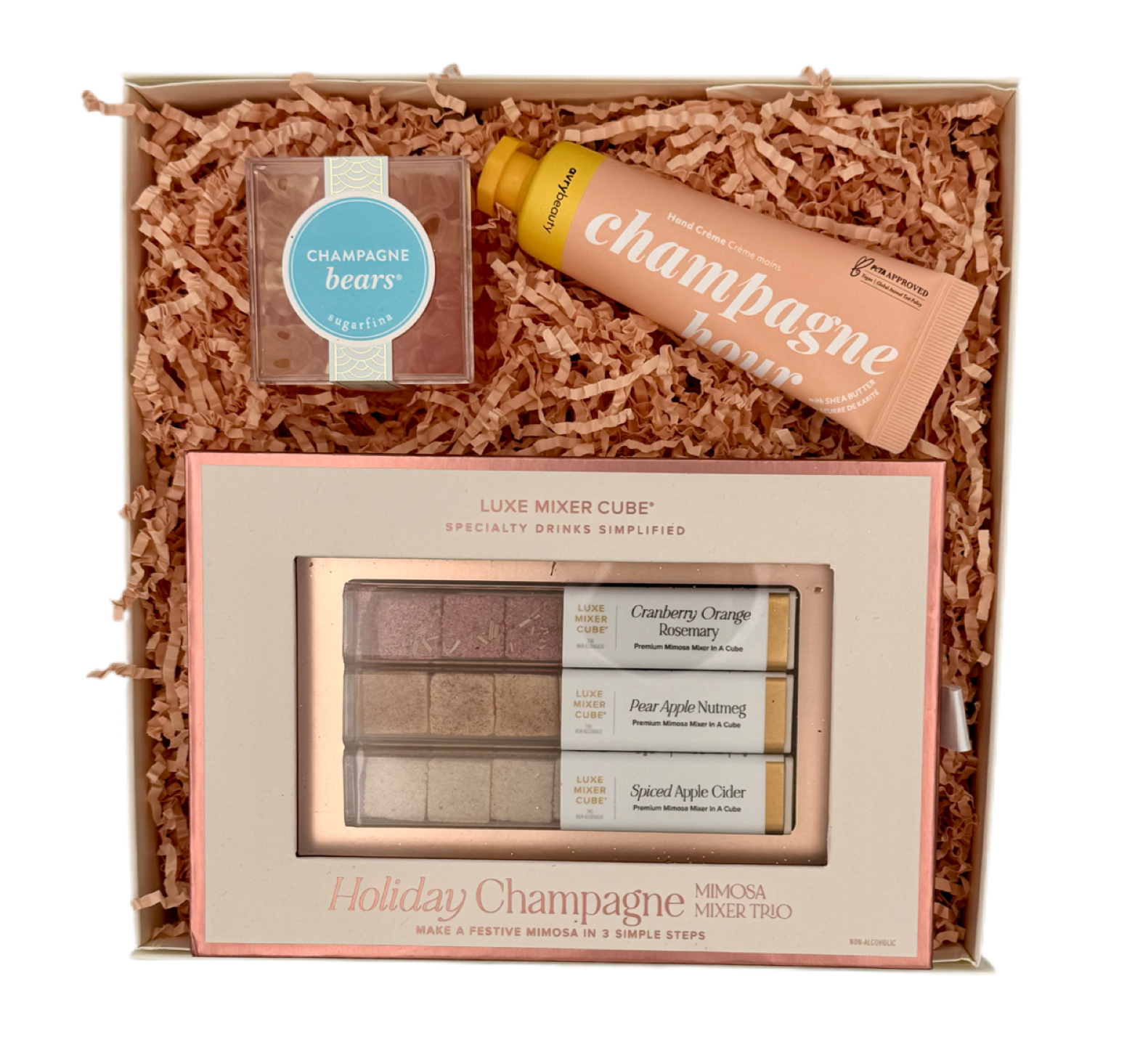 Gift set with Champagne Bears products including a bottle, box, and mixer cube in a decorative box.