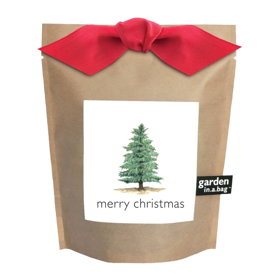 Kraft paper bag with a red ribbon and a Christmas tree label on a white background