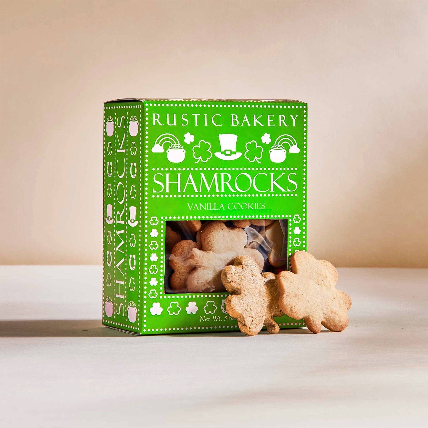 Box of Rustic Bakery Shamrocks Vanilla Cookies with cookies on a white surface