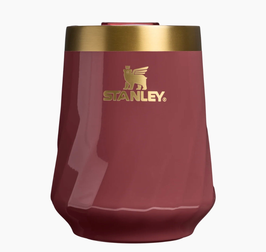 Red insulated cup with gold rim and Stanley logo on a white background