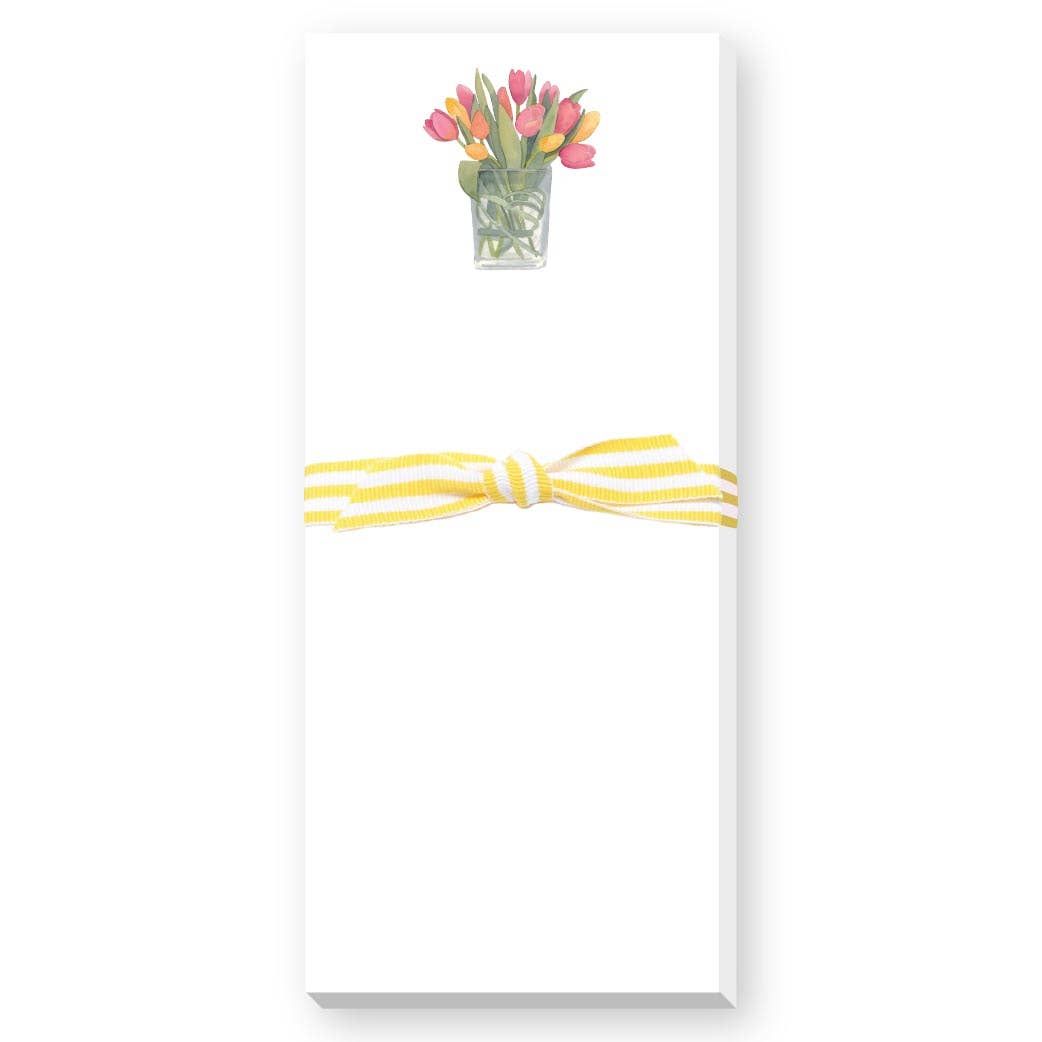 Notepad with a floral design and yellow ribbon on a white background