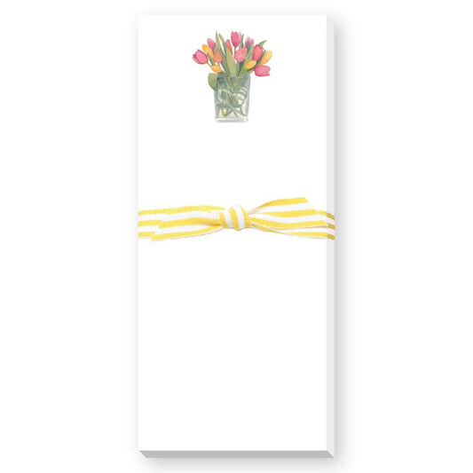 Notepad with a floral design and yellow ribbon on a white background